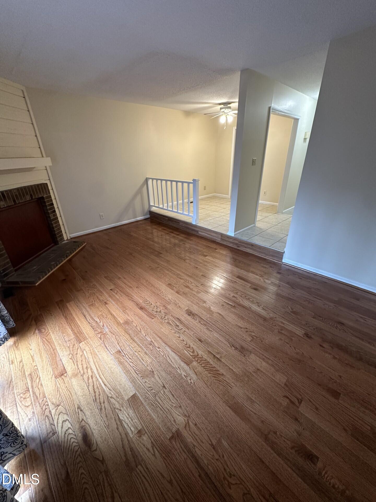 4912 North New Hope Road Raleigh, NC 27616 - Photo 6 of 14 an empty room with wooden floor and windows