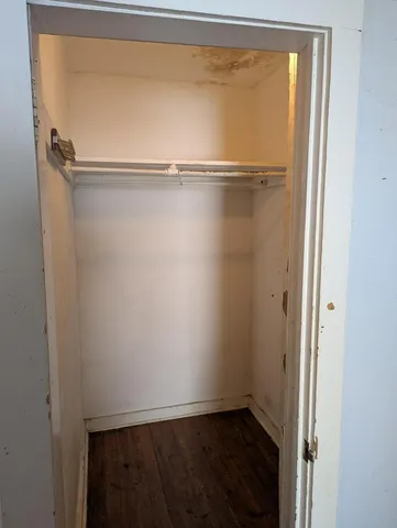 a toilet sitting in a bathroom next to a sink