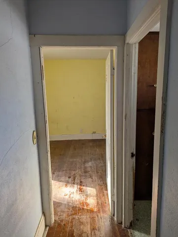 a kitchen with a sink appliances cabinets and a window
