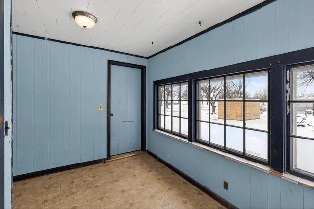 a view of an empty room with a window