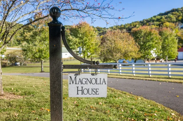 a large kitchen with stainless steel appliances granite countertop a lot of counter space and wooden floors