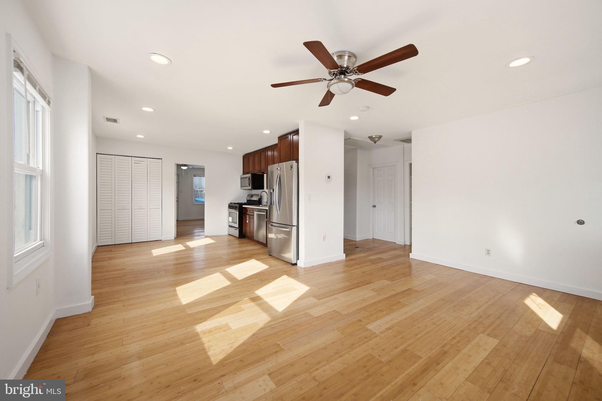 1812 Kitty Hawk Road Essex, MD 21221 - Photo 11 of 44 a view of a livingroom with a ceiling fan and window