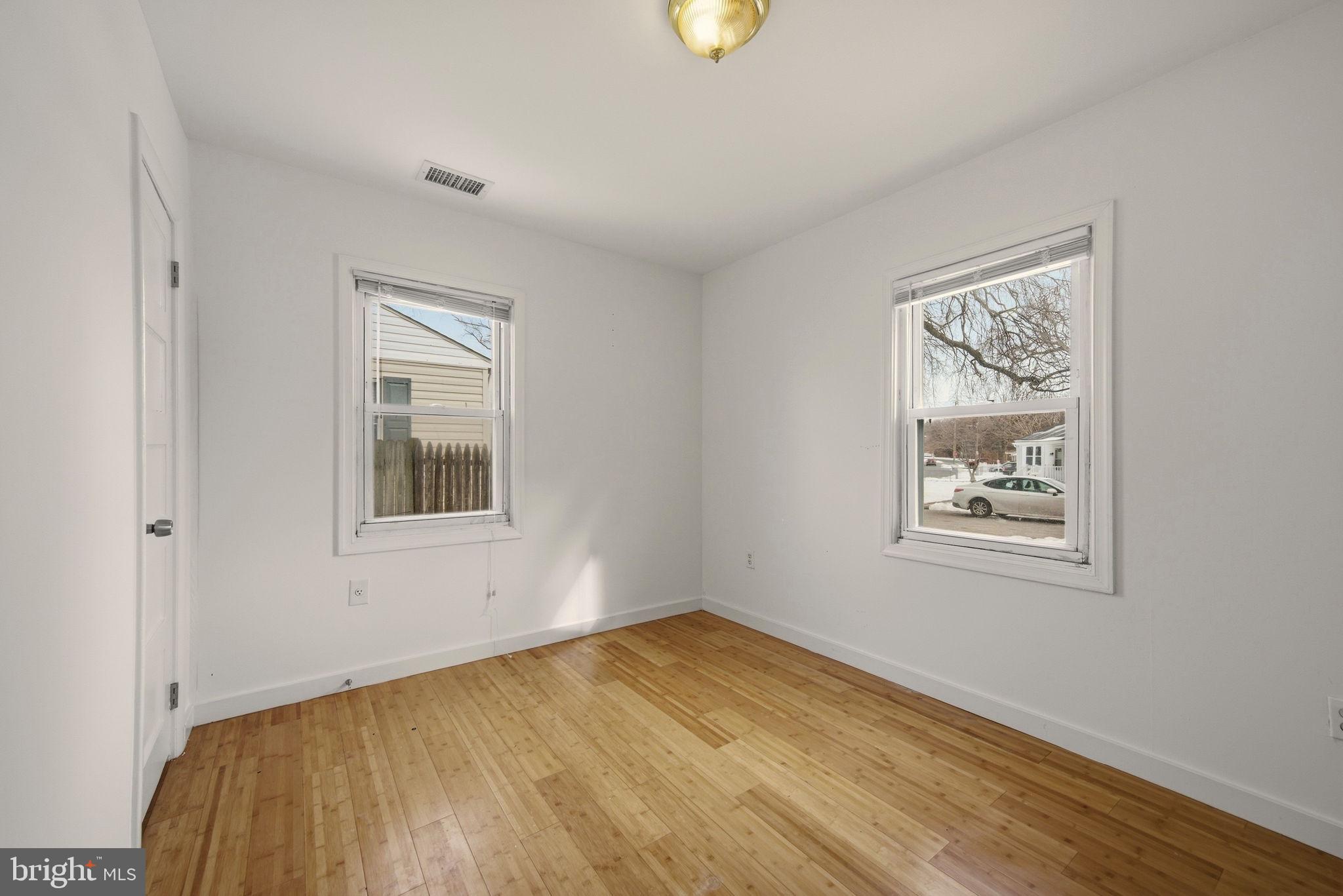 1812 Kitty Hawk Road Essex, MD 21221 - Photo 20 of 44 a view of an empty room with a window and closet area
