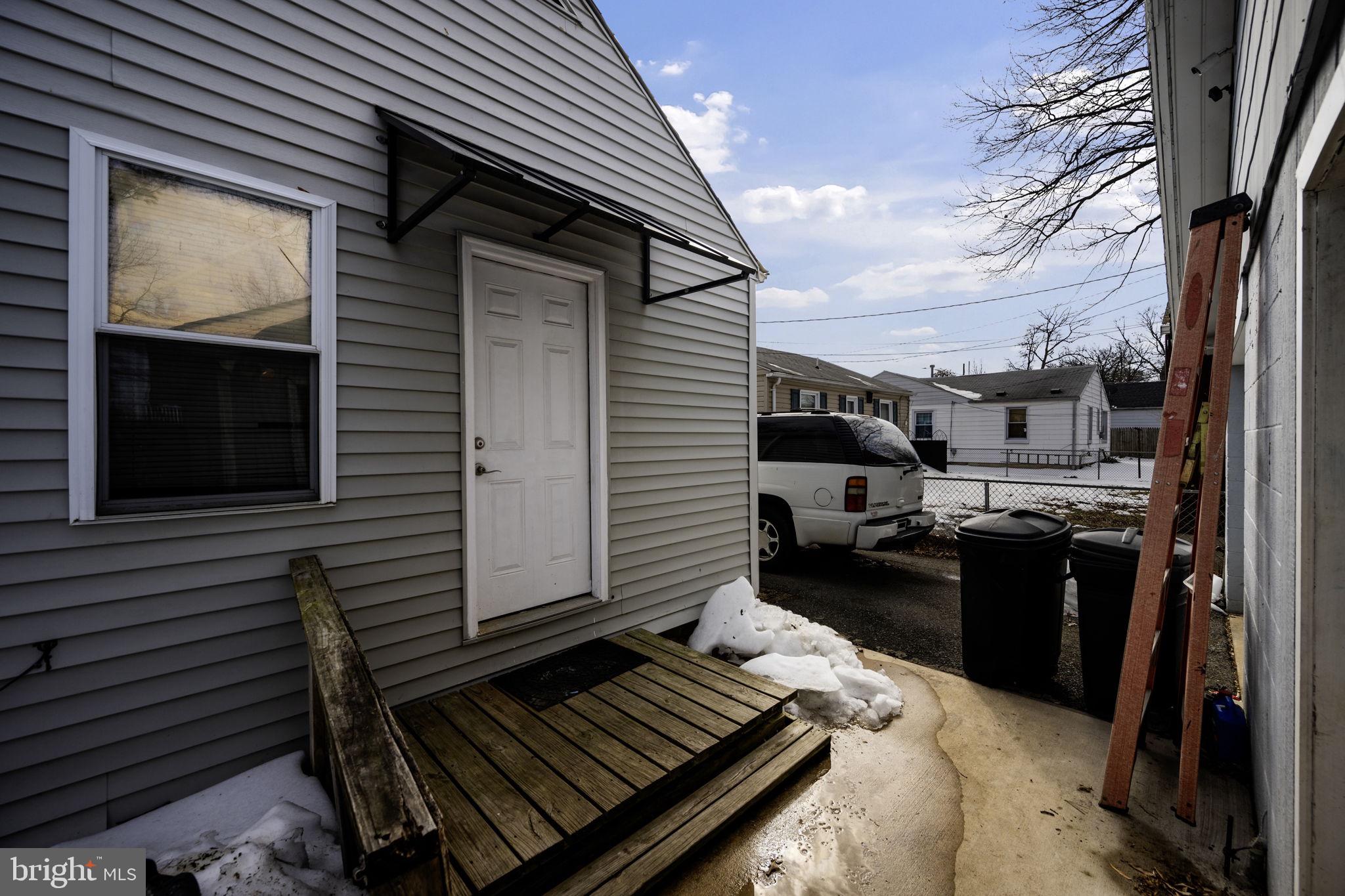 1812 Kitty Hawk Road Essex, MD 21221 - Photo 31 of 44 a view of a patio with a table and chairs