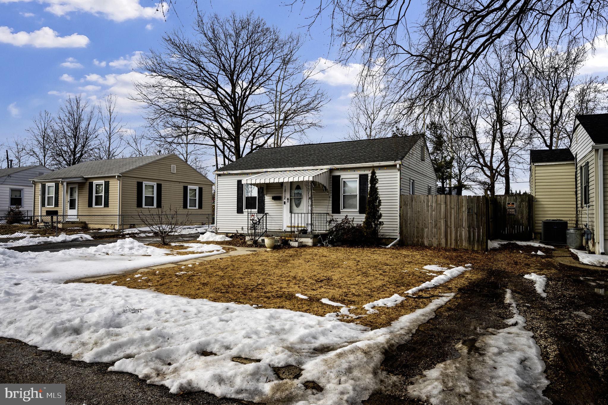 1812 Kitty Hawk Road Essex, MD 21221 - Photo 4 of 44 a view of a house with snow on the side of the road