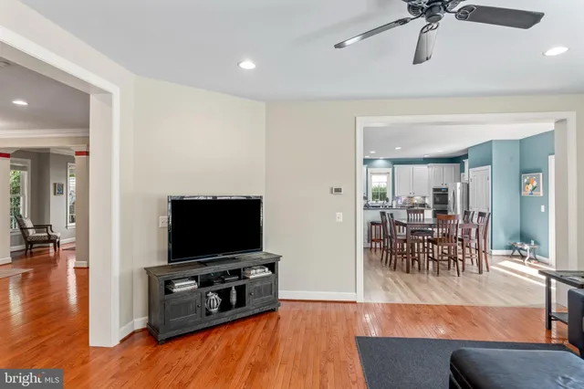 a kitchen with granite countertop white cabinets sink and stainless steel appliances