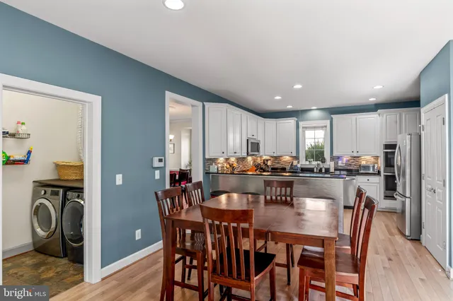 a bedroom with a large bed and a large window