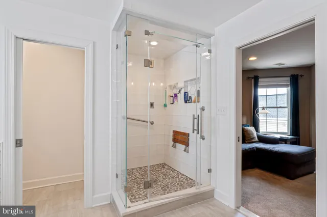 a bedroom with furniture and a book shelf