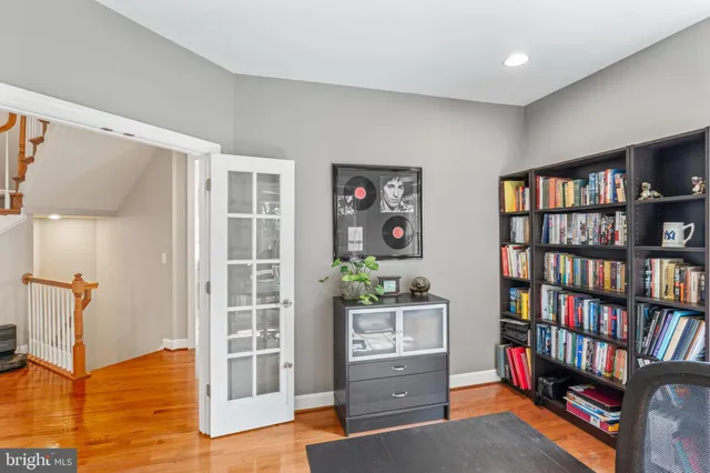 a living room with fireplace furniture and a flat screen tv