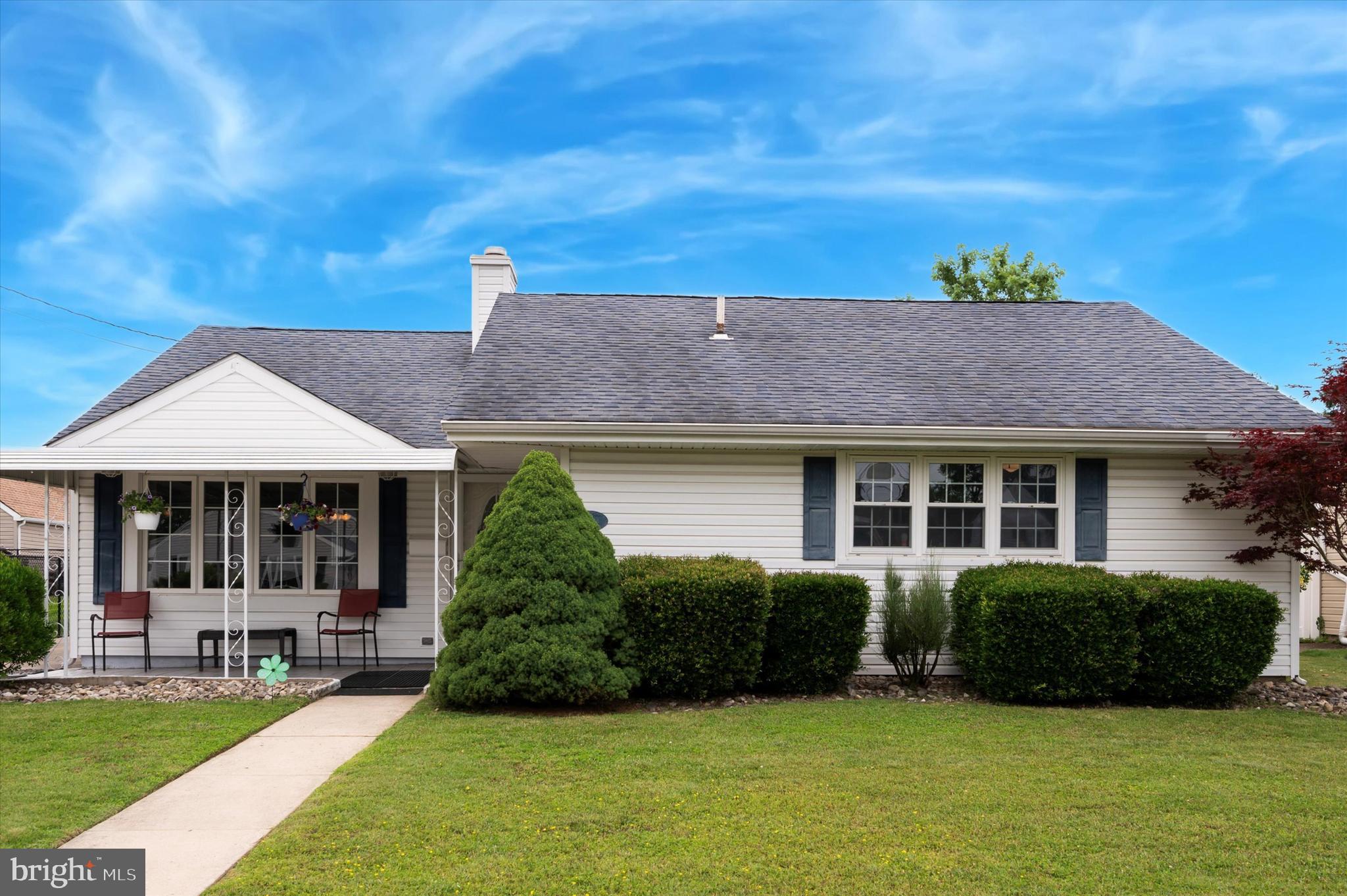 a view of a house with a yard and plants