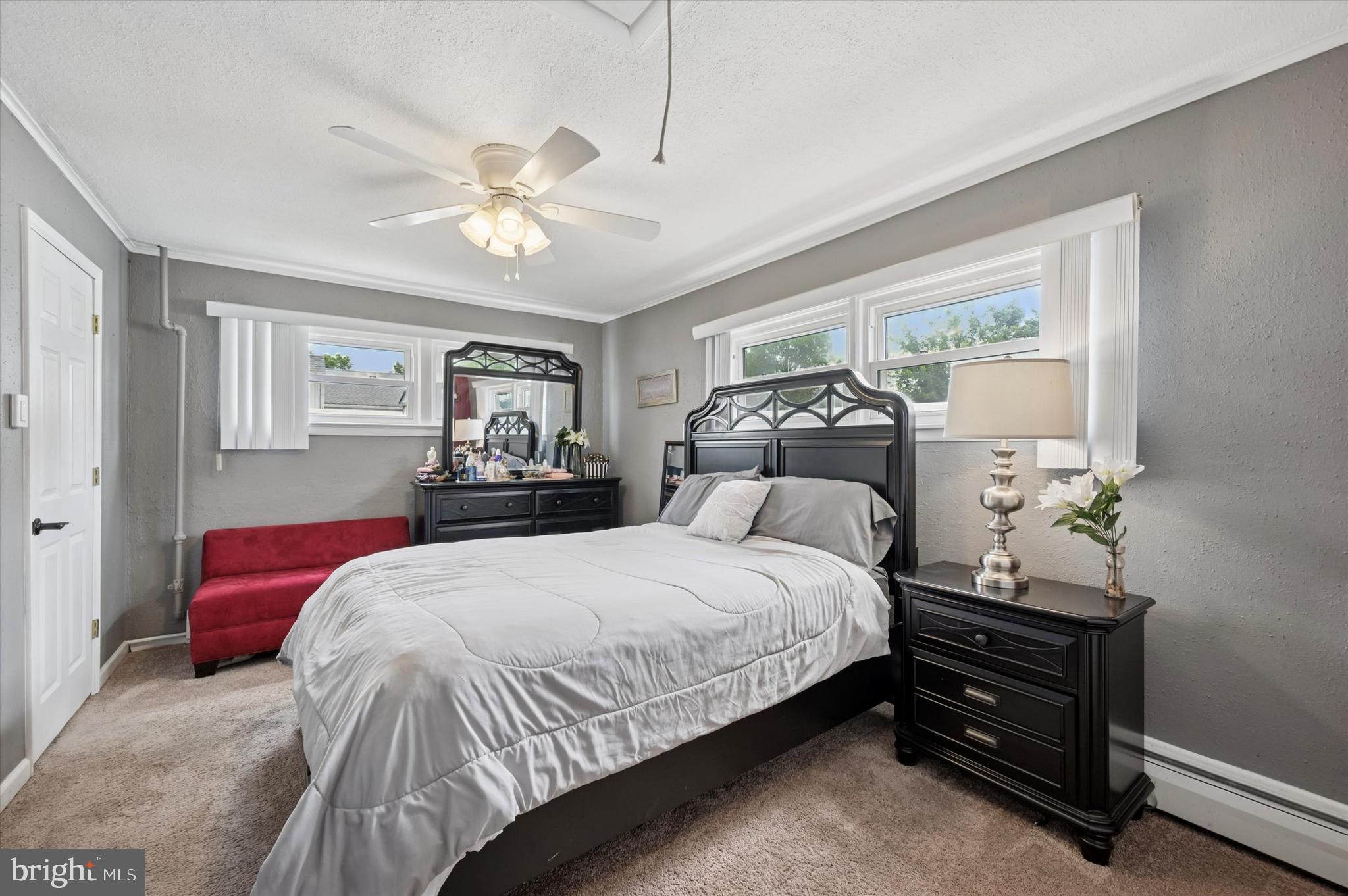 15 Paul Road Maple Shade, NJ 08052 - Photo 13 of 26 a bedroom with a bed and a chandelier