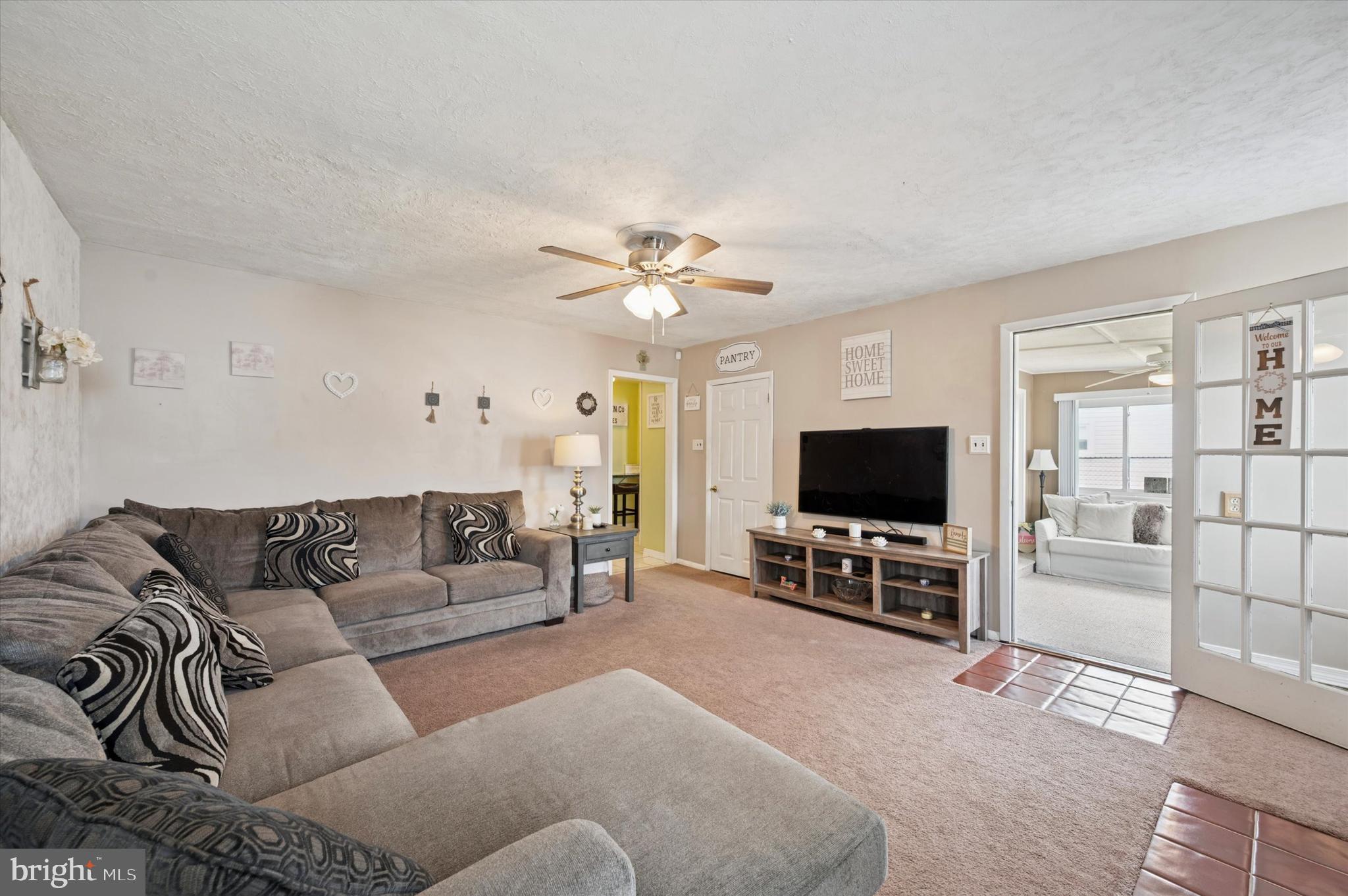 15 Paul Road Maple Shade, NJ 08052 - Photo 17 of 26 a living room with furniture and a flat screen tv