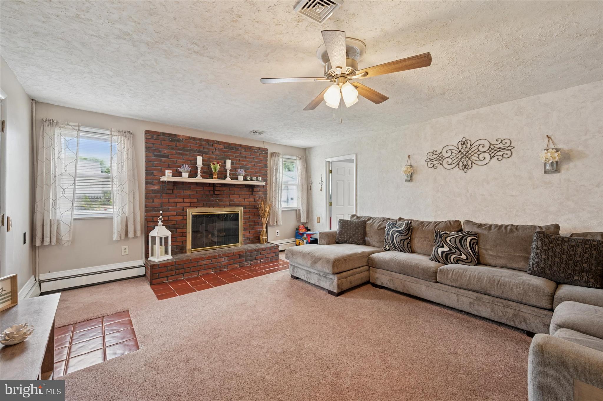 15 Paul Road Maple Shade, NJ 08052 - Photo 18 of 26 a living room with furniture and a fireplace