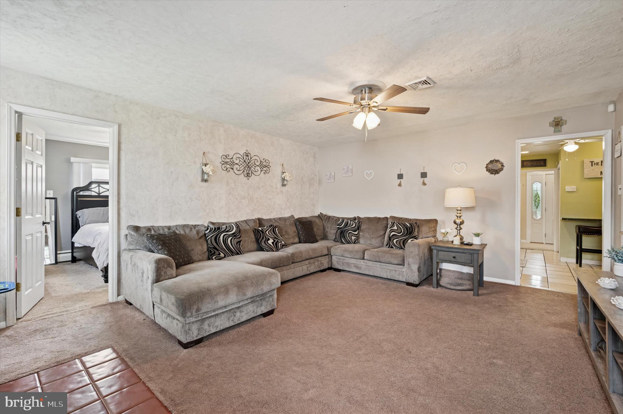 15 Paul Road Maple Shade, NJ 08052 - Photo 19 of 26 a living room with furniture and a chandelier