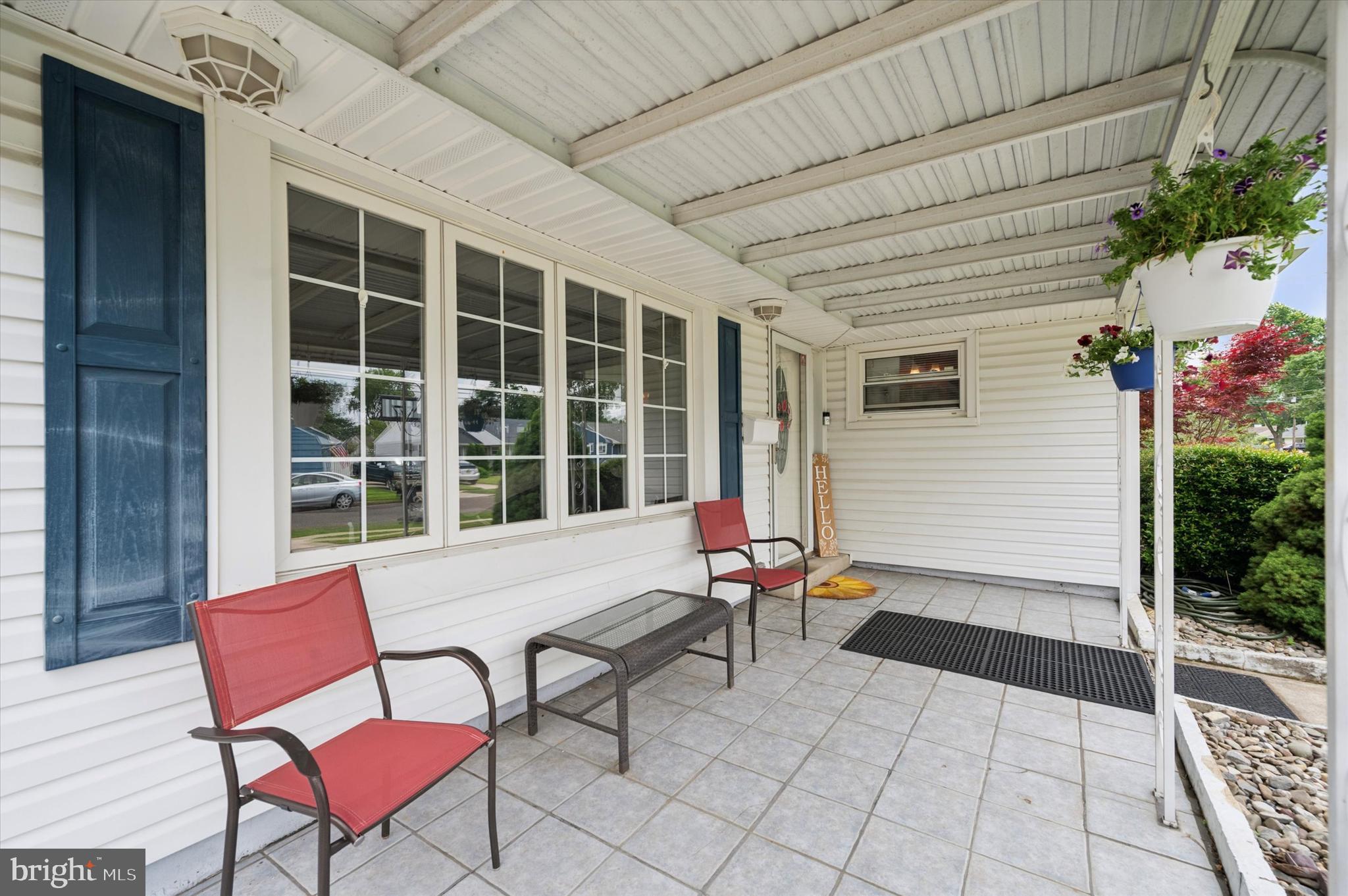 15 Paul Road Maple Shade, NJ 08052 - Photo 3 of 26 a balcony with furniture and a potted plant
