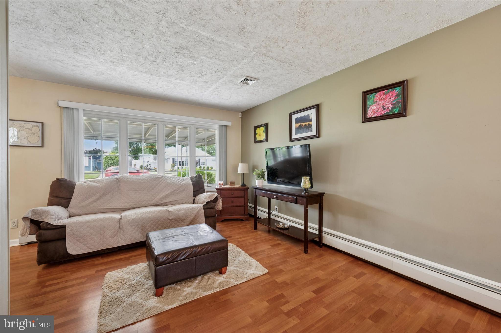 15 Paul Road Maple Shade, NJ 08052 - Photo 4 of 26 a living room with furniture and a flat screen tv