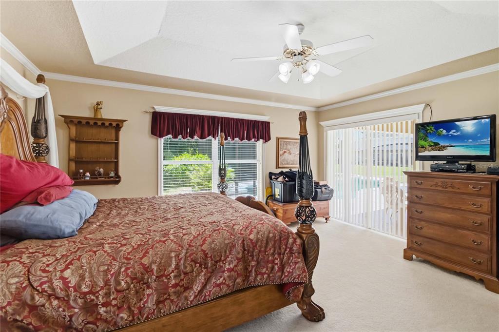 3225 Canoe Creek Road St. Cloud, FL 34772 - Photo 22 of 30 a bed sitting in a bedroom next to a window