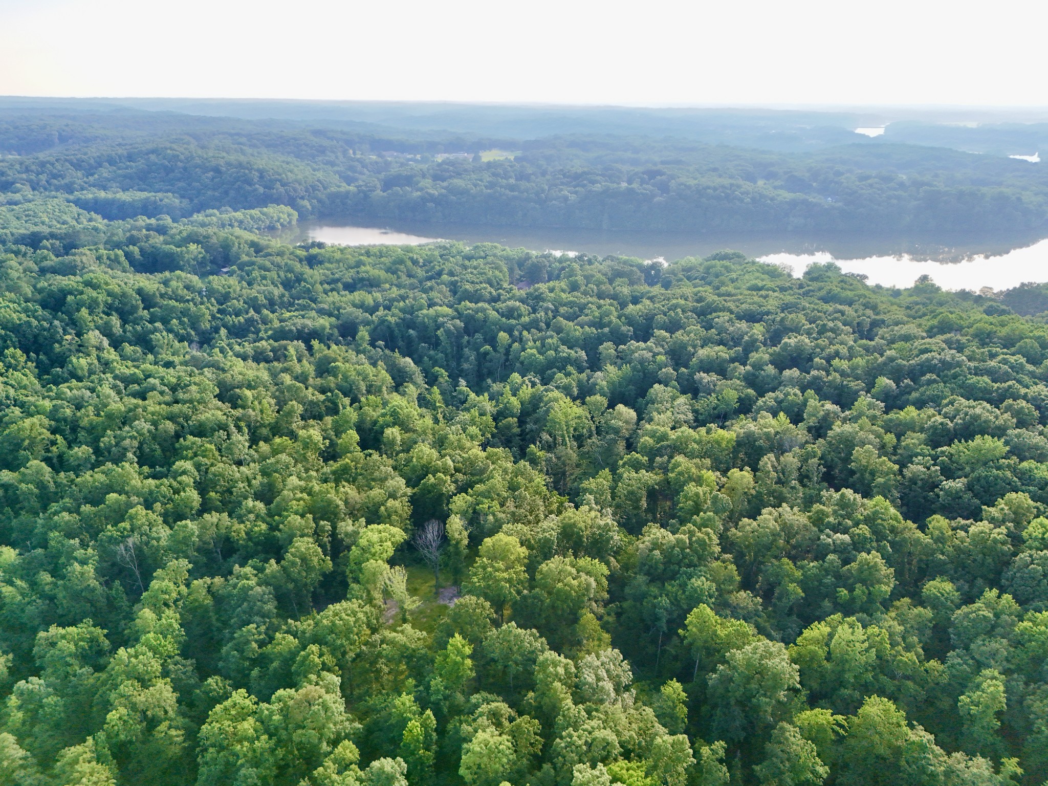 0 Wildlife Road Dover, TN 37058 - Photo 9 of 26 an aerial view of a house with a yard and mountain view in back
