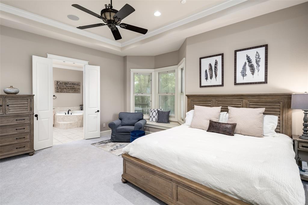 1814 Stacy Road Fairview, TX 75069 - Photo 17 of 36 a bedroom with bed and window