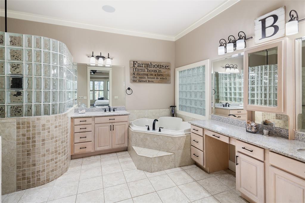 1814 Stacy Road Fairview, TX 75069 - Photo 18 of 36 a spacious bathroom with a double vanity sink mirror and bathtub