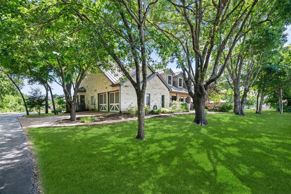 1814 Stacy Road Fairview, TX 75069 - Photo 2 of 36 a view of a house with backyard and a tree