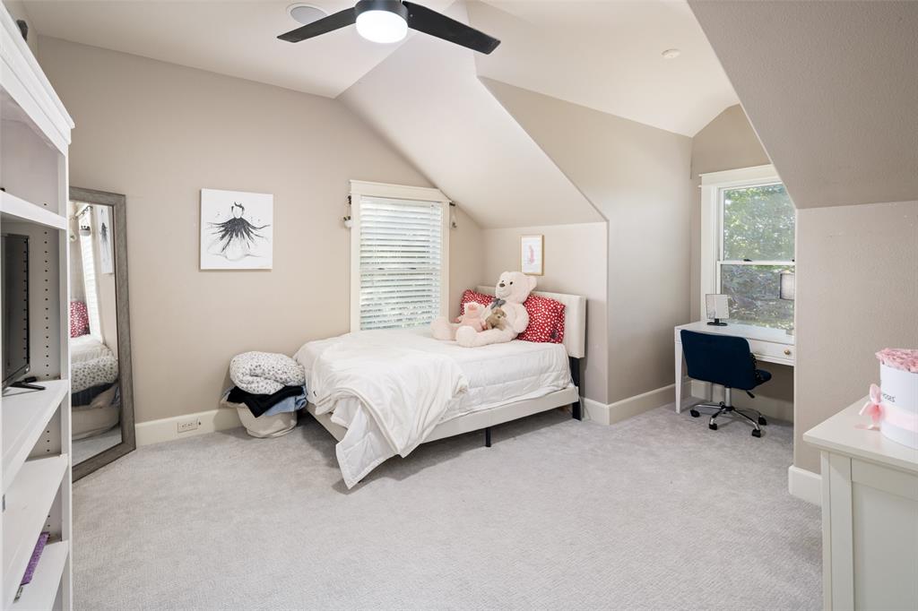 1814 Stacy Road Fairview, TX 75069 - Photo 22 of 36 a bedroom with a bed and a desk