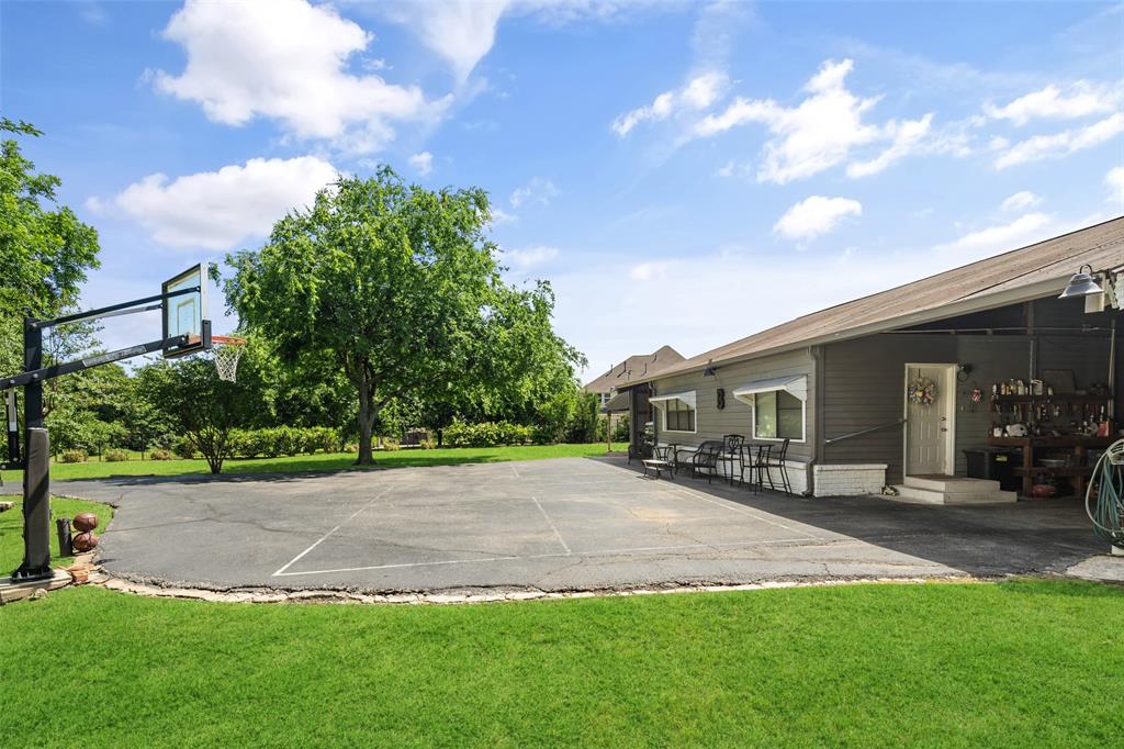 1814 Stacy Road Fairview, TX 75069 - Photo 26 of 36 a view of a yard in front of a house with a large tree