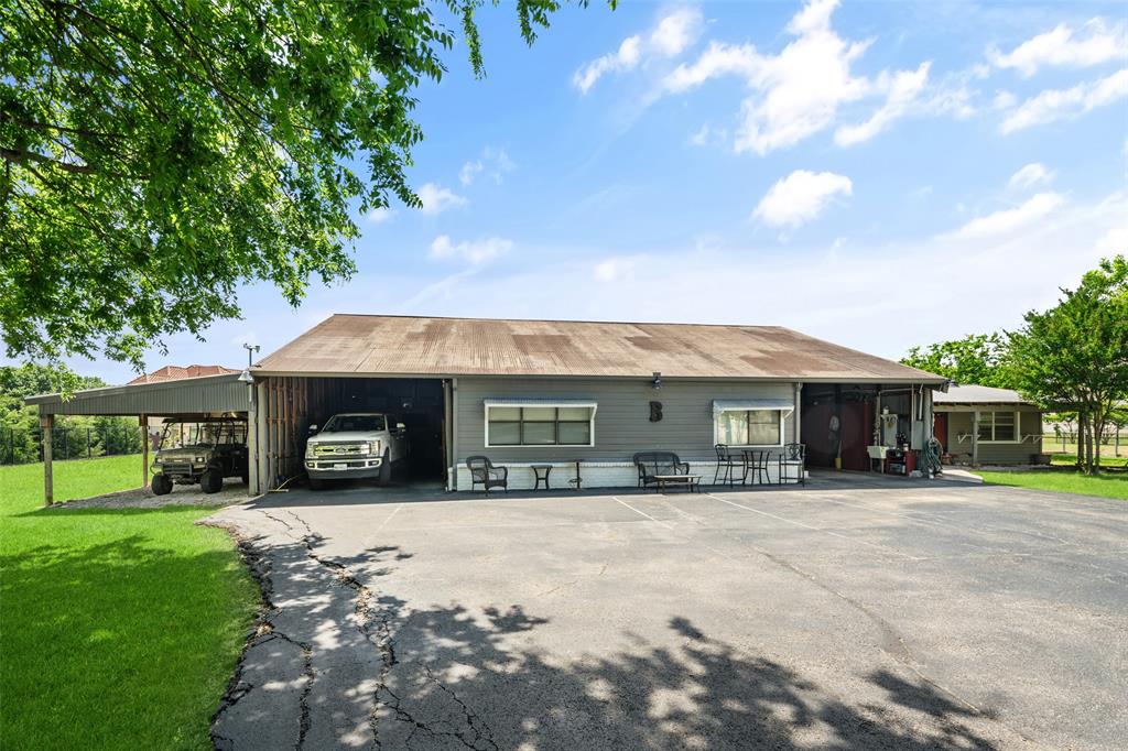 1814 Stacy Road Fairview, TX 75069 - Photo 28 of 36 a front view of a house with a yard and garage