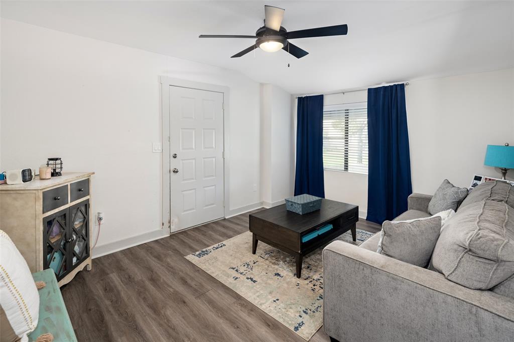 1814 Stacy Road Fairview, TX 75069 - Photo 29 of 36 a living room with furniture and a fireplace