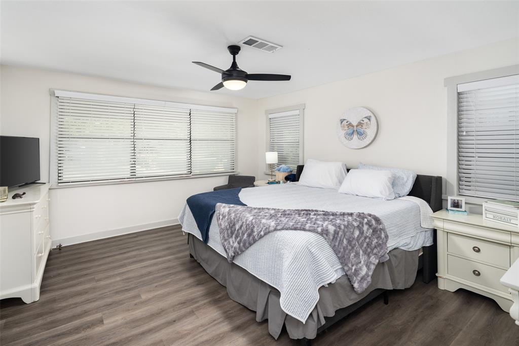 1814 Stacy Road Fairview, TX 75069 - Photo 30 of 36 a bedroom with a large bed and a tv