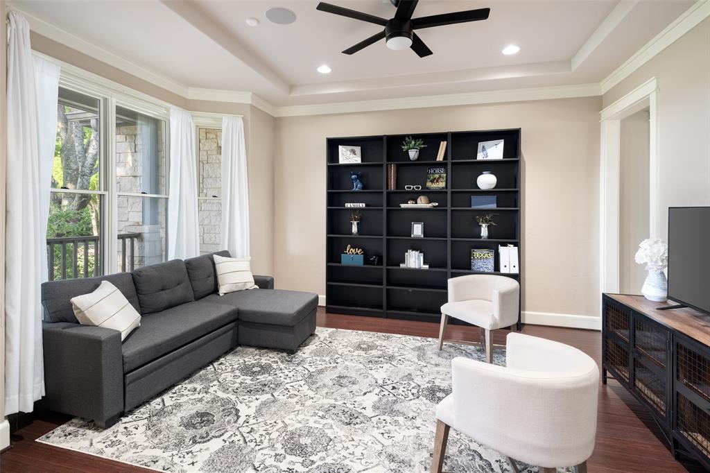 1814 Stacy Road Fairview, TX 75069 - Photo 8 of 36 a living room with furniture and a flat screen tv