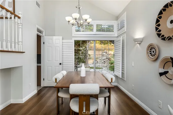 a kitchen with granite countertop a sink stainless steel appliances and cabinets