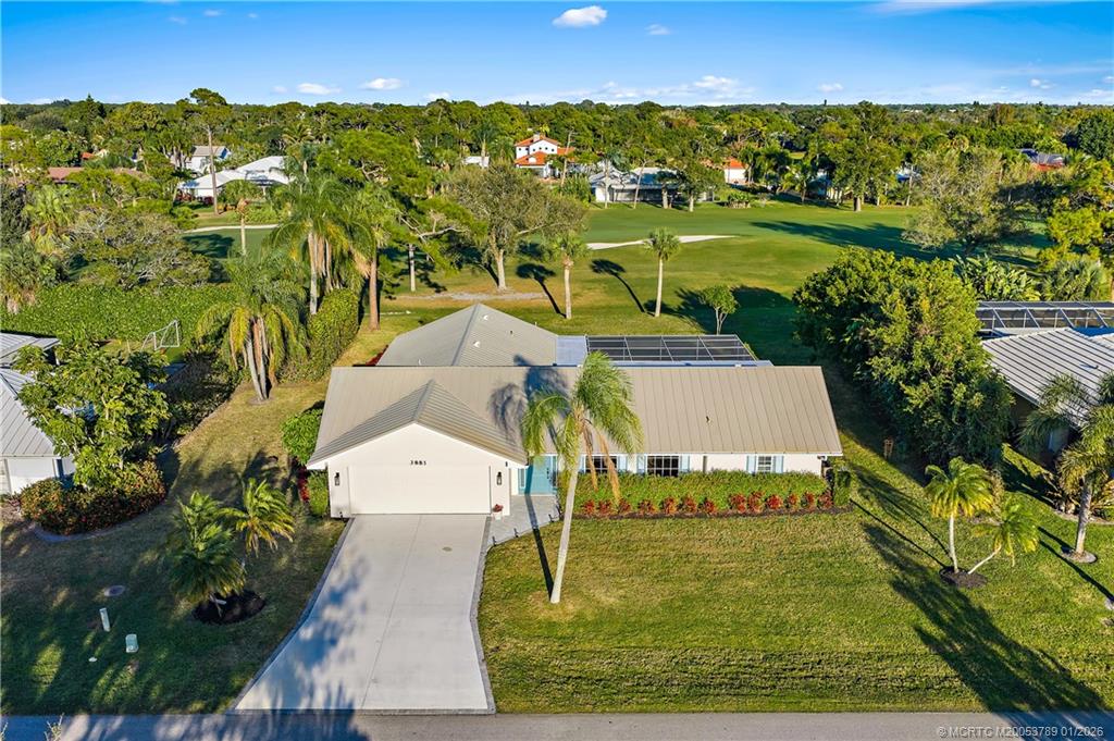 an aerial view of a house with a yard lake view and mountain view