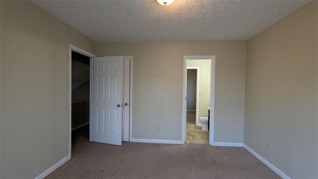 3699 Oakwood Manor Court Decatur, GA 30032 - Photo 15 of 21 an empty room with closet and a bathroom