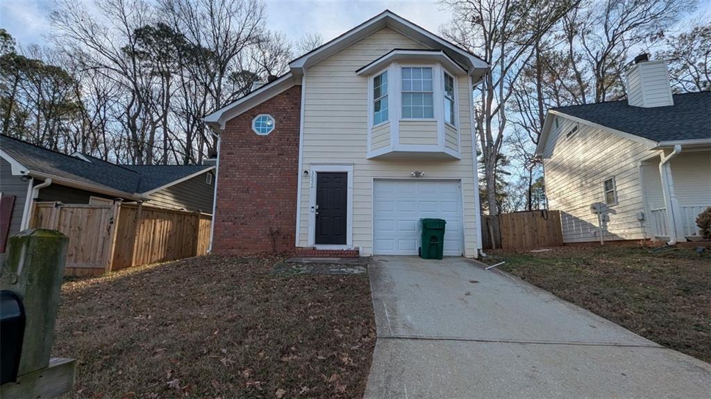 3699 Oakwood Manor Court Decatur, GA 30032 - Photo 20 of 21 a front view of a house with yard