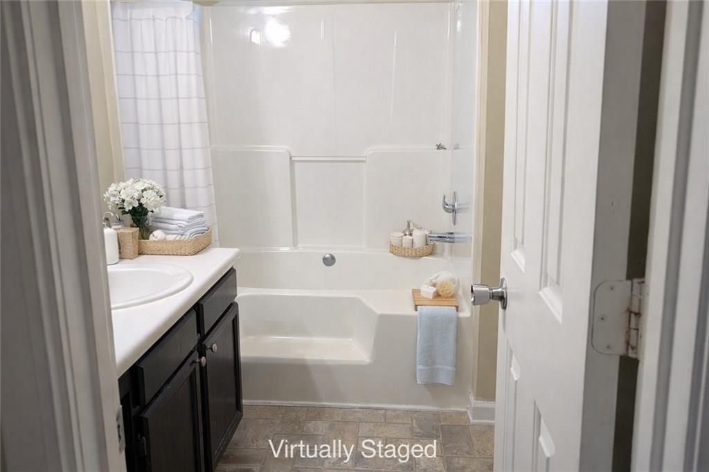 3699 Oakwood Manor Court Decatur, GA 30032 - Photo 8 of 21 a bathroom with a tub sink and mirror