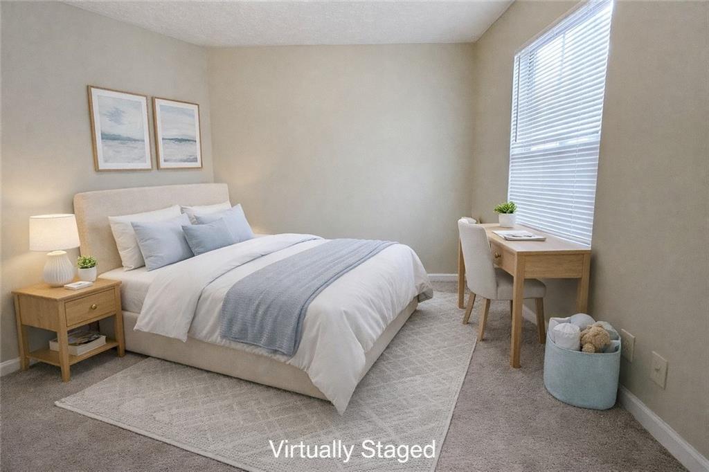 3699 Oakwood Manor Court Decatur, GA 30032 - Photo 9 of 21 a bedroom with a bed and a table in it