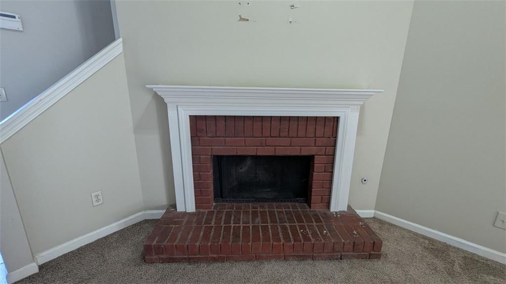 3699 Oakwood Manor Court Decatur, GA 30032 - Photo 10 of 21 a living room with a fireplace and a rug
