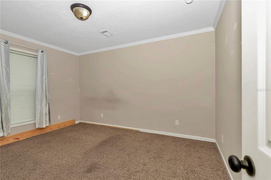 7565 Dewey Robbins Road Howey-in-the-Hills, FL 34737 - Photo 26 of 42 a view of an empty room