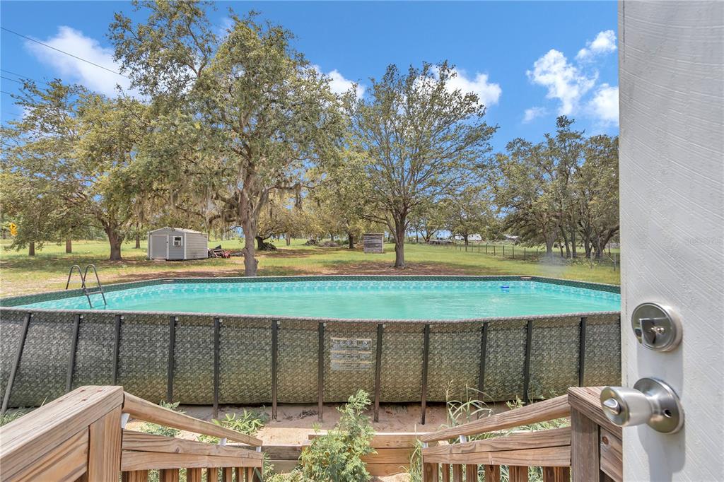 7565 Dewey Robbins Road Howey-in-the-Hills, FL 34737 - Photo 35 of 42 a view of a yard with an outdoor space