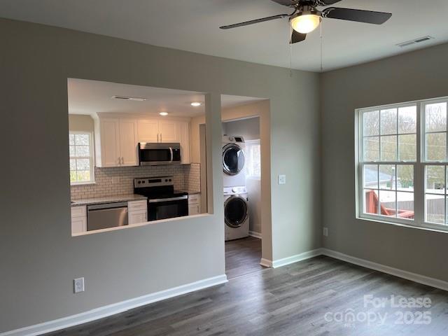 384 Washington Street, Unit 6 Cramerton, NC 28032 - Photo 5 of 10 a kitchen with stainless steel appliances kitchen island granite countertop a stove and a refrigerator