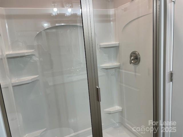 384 Washington Street, Unit 6 Cramerton, NC 28032 - Photo 10 of 10 a bathroom with a granite countertop shower and a toilet