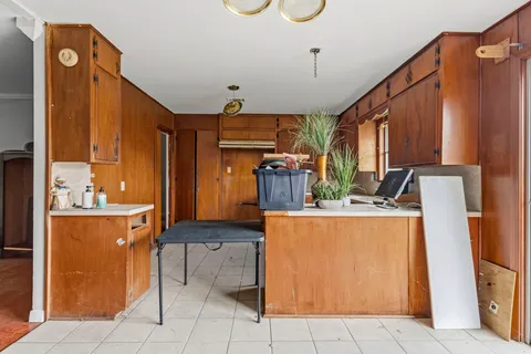 a view of kitchen with appliances and cabinets