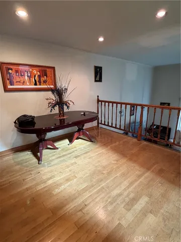 a room with wooden cabinets and furniture