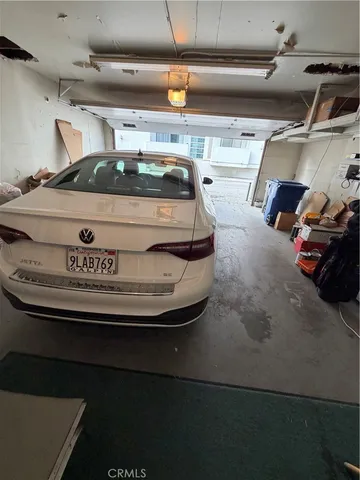 a view of backyard with wooden fence