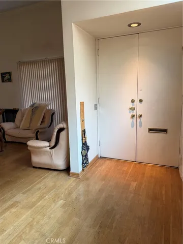 a view of a livingroom with a couch and a fireplace