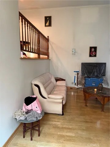 a living room with furniture and a rug