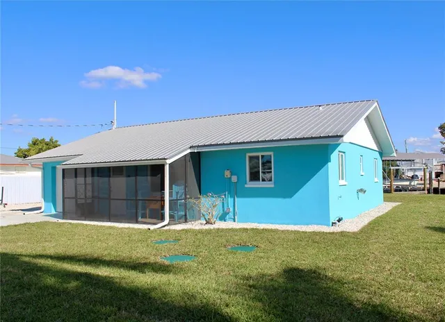 a front view of house with yard and garage