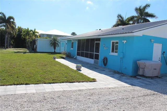 a kitchen with stainless steel appliances granite countertop a sink refrigerator and microwave