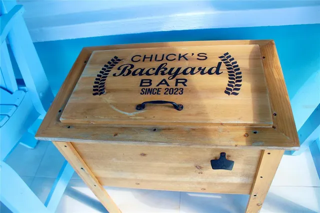 a kitchen with a table chairs refrigerator and window